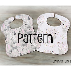 May include: Two pink and white baby bibs with a deer and floral pattern. The bibs are on a wooden surface. The text "Pattern" is in the center of the image. The text "Lavender Lily Design" is at the bottom of the image.