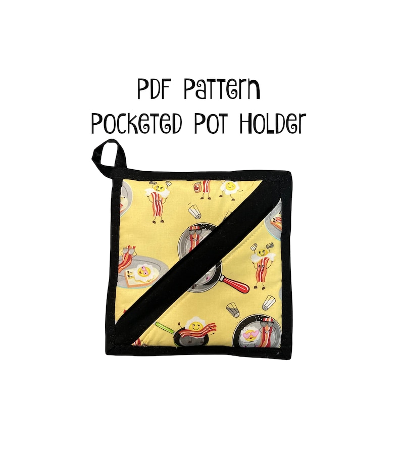 May include: A yellow and black potholder with a pocket. The potholder has a pattern of cartoon eggs and bacon.