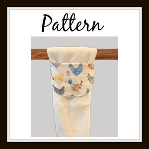 May include: White kitchen towel with a decorative chicken pattern. The towel has a pocket with a repeating pattern of colorful chickens. The word "Pattern" is written in black script at the top of the image.