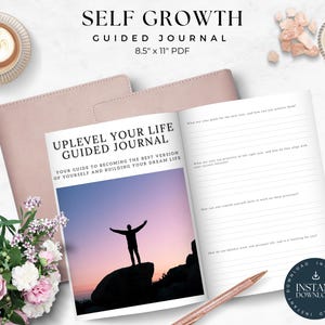 May include: A pink journal with the title "Uplevel Your Life Guided Journal" and the text "Your guide to becoming the best version of yourself and building your dream life". The journal is open to a page with a silhouette of a person standing on a rock with a sunset in the background. The journal is 8.5 inches by 11 inches and is a PDF download.
