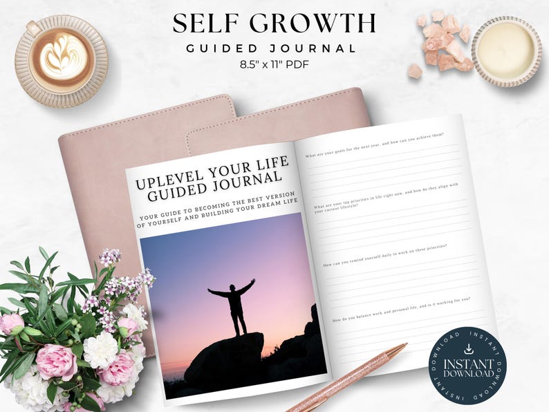 May include: A pink journal with the title "Uplevel Your Life Guided Journal" and the text "Your guide to becoming the best version of yourself and building your dream life". The journal is open to a page with a silhouette of a person standing on a rock with a sunset in the background. The journal is 8.5 inches by 11 inches and is a PDF download.