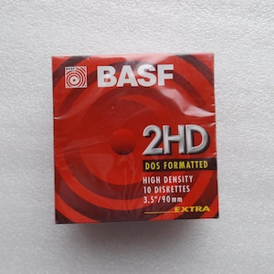 May include: A red and black box of BASF 2HD DOS formatted high-density 3.5"/90mm diskettes. The box features the BASF logo and the word "EXTRA".