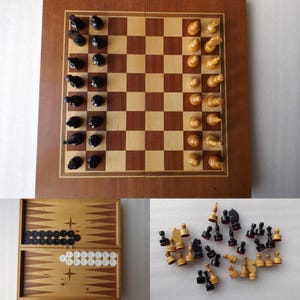 May include: A wooden chess set with black and white pieces arranged on a checkered board. A backgammon set with black and white checkers is also visible, along with a pile of chess pieces.
