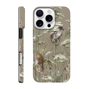May include: A phone case featuring a detailed illustration of two mice among white wildflowers and green foliage. The case has a neutral beige background and a matching side profile.