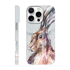 May include: A phone case featuring a detailed painting of a hare. The artwork showcases the hare's profile with brown, pink, and white brushstrokes against a light gray background. The case has a side view showing a light gray color with a camera cutout.