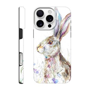 May include: A white phone case featuring a watercolor painting of a hare. The hare has brown and white fur, with long ears and a detailed face. The background includes blue and purple flowers and green grass.