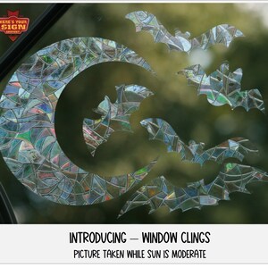 May include: A set of five iridescent window clings featuring bats and a crescent moon. The clings are designed to look like stained glass.