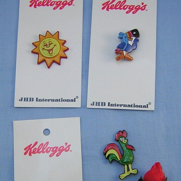 4 JHB Kellogg's Character Buttons, Realistic Aluminum & Wood Designs, Cornelius Rooster, Coco Monkey, Toucan Sam, The Sun, Original Cards