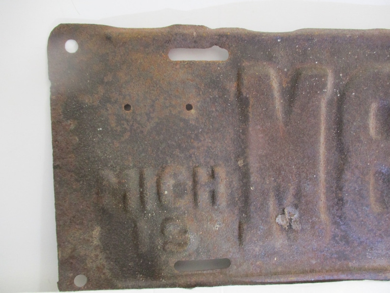 License plate is from 1911 Early Brass Age car license plate 10/% off was 200. is for Michigan and is # M89