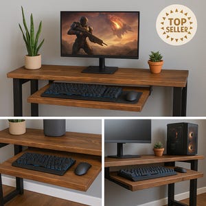 May include: A brown wooden computer desk with a black metal frame. The desk has a pull-out keyboard tray, a black keyboard, and a black mouse. A computer monitor displays a video game scene. A small potted plant sits on the desk.