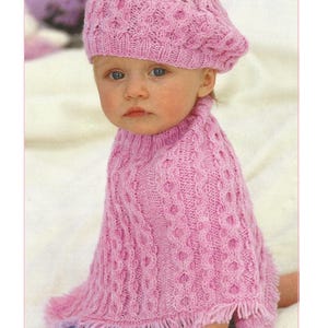 May include: A pink knitted poncho and beret set. The poncho has a textured pattern and fringe trim. The beret matches the poncho's design. The text "Poncho & Beret Knitting Pattern" is at the top. The number "60" is at the bottom.