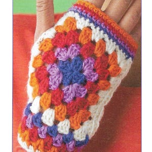 May include: Colorful crochet fingerless gloves with a granny square pattern. The gloves are made with white, orange, red, purple, and blue yarn. The pattern is CA117.