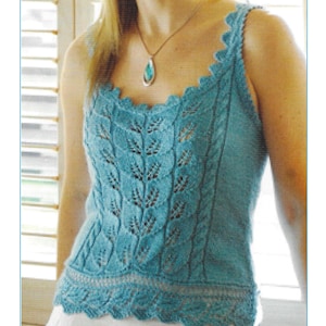 May include: A teal blue sleeveless knitted vest with a delicate lace pattern. The vest has a scoop neck and a scalloped hem. The image also includes the text "K 456".