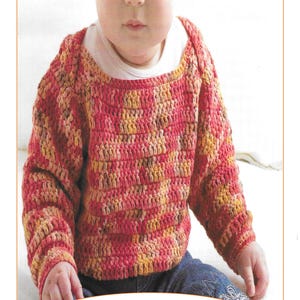 May include: A child's crochet jumper in shades of red, yellow, and brown. The image includes the text "Easy Jumper Crochet Pattern" and "CB208". The jumper is made from yarn and is a close-up shot.
