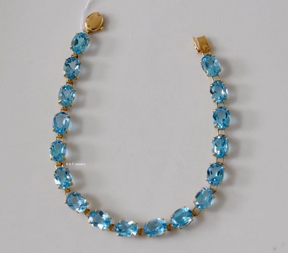 14kt White Or Yellow Gold Oval 18ctw Swiss Blue Topaz Bracelet
