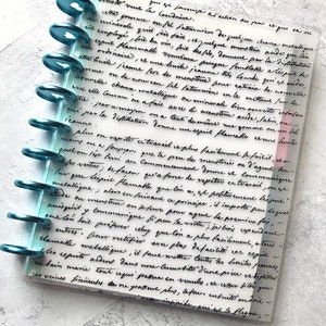 May include: A close-up of a page from a journal with handwritten text in black ink on a white background. The text is about the process of extracting a flammable spirit from a mineral. The page is bound with teal rings.