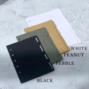 May include: Three different colored dividers for a planner or notebook. The dividers are labeled "Inbox, Agenda, Memo, Archive". The colors are black, pebble, and peanut.