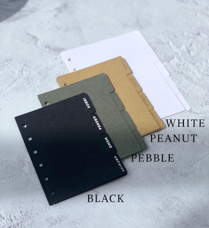 May include: Three different colored dividers for a planner or notebook. The dividers are labeled "Inbox, Agenda, Memo, Archive". The colors are black, pebble, and peanut.