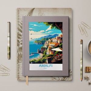 May include: A grey travel journal with a colourful illustration of Amalfi, Italy on the cover. The journal has a spiral binding and a brown bookmark.