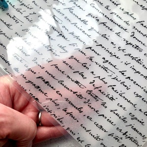 May include: A close-up of a handwritten note on a sheet of paper. The note is written in cursive and contains a variety of words and phrases, including "flamable", "principle", "metallique", "esprit", and "distiller".