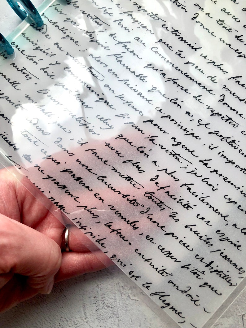May include: A close-up of a handwritten note on a sheet of paper. The note is written in cursive and contains a variety of words and phrases, including "flamable", "principle", "metallique", "esprit", and "distiller".