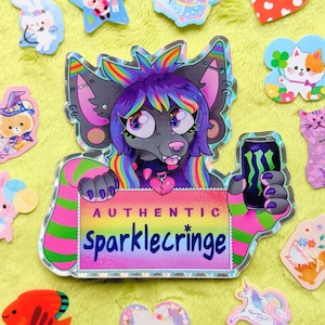 May include: A selection of vibrant stickers on a yellow surface. The main sticker depicts a cartoon character with rainbow hair and a Monster energy drink. Other stickers include a cat, bunny, and star.