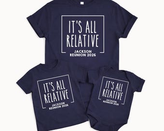 May include: Three navy blue t-shirts and a babygrow with the text "IT'S ALL RELATIVE JACKSON REUNION 2026" in a white square. The shirts are short-sleeved, and the babygrow has short sleeves.