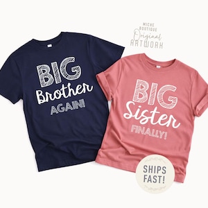 May include: Two short-sleeved t-shirts. One is navy blue with the words "BIG Brother AGAIN!" in white. The other is dusty rose with "BIG Sister FINALLY!" in white. The shirts are for siblings.
