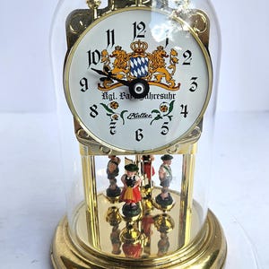 Vintage German Clock by Haller with Spinning German Characters and Glass Dome - Works - Missing Minute Hand