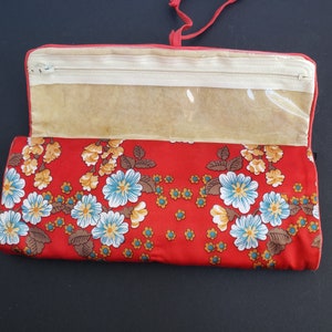 Red Satin Folding Jewelry Holder with Plastic Zippered Pockets and Double Snap Bottom Pocket