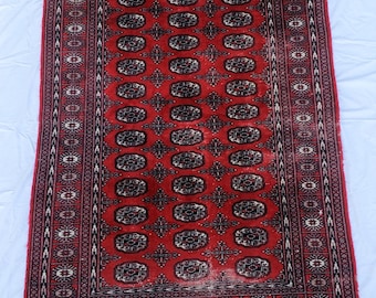 Knotted Red with Dark Details Possibly Bokhara Style Wool Rug - Signed