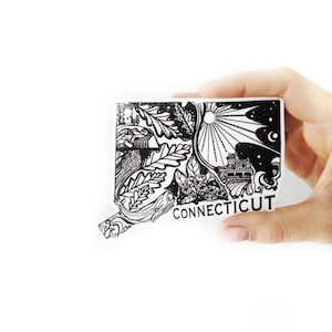 May include: Black and white sticker of the state of Connecticut with a detailed illustration of various landmarks and natural elements. The sticker includes the word "CONNECTICUT" at the bottom.