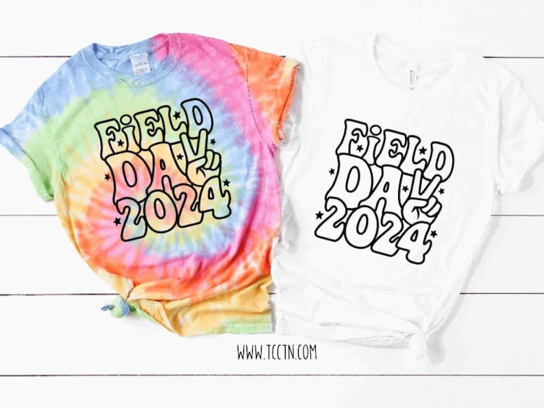 May include: Two t-shirts with a tie-dye design and a white design. Both shirts feature a black graphic that says "Field Day 2024" in a retro font with stars.