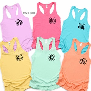 May include: Six different colored tank tops with a monogram on the front. The tank tops are in the colors lavender, pink, light blue, yellow, mint green, and peach.