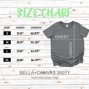 May include: Size chart for a youth unisex jersey t-shirt, showing chest and length measurements in inches for sizes S, M, L, and XL. The chart is on a woodgrain background with a gray t-shirt displayed next to it.