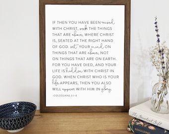 May include: A framed print with a white background and black text. The text is a bible verse from Colossians 3:1-4. The verse reads: "If then you have been raised with Christ, seek the things that are above, where Christ is, seated at the right hand of God. Set your mind on things that are above, not on things that are on earth. For you have died, and your life is hidden with Christ in God. When Christ who is your life appears, then you also will appear with him in glory." -Colossians 3:1-4