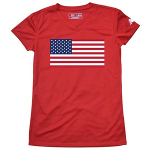 May include: Red short-sleeved v-neck t-shirt with a blue and white American flag graphic on the front.
