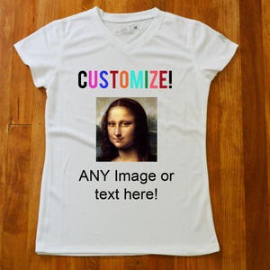 May include: White v-neck t-shirt with the text "CUSTOMIZE!" in rainbow colours. The shirt features a picture of the Mona Lisa painting and the text "ANY Image or text here!"