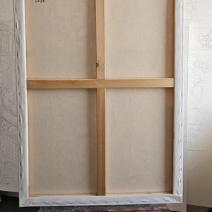May include: Back of a stretched canvas artwork titled "The Muse and The Musician" by Van Hovak. The canvas is 36 x 24 inches, with oil and mixed media on canvas, dated 2024. The wooden frame is visible.