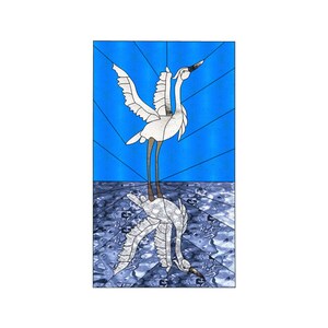 May include: A stained glass window depicting a white bird with its wings spread, standing on a blue and white patterned surface. The bird's reflection is visible in the water below.