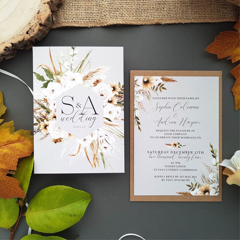Boho wedding invitation set complete with envelopes. Boho floral in a wreath with bride and grooms name in centre with details of wedding on the back.