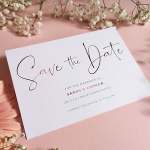 Save the date cards A6 size with rose gold script font, includes couples names, wedding date and optional venue