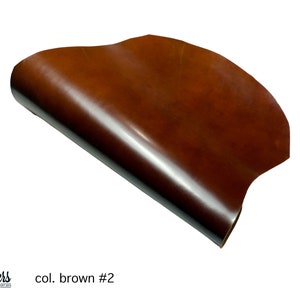 May include: A close-up of a brown leather sheet, rolled up and showing the texture of the leather. The text "col. brown #2" is visible in the lower right corner of the image.