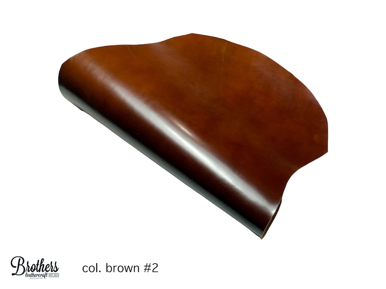 May include: A close-up of a brown leather sheet, rolled up and showing the texture of the leather. The text "col. brown #2" is visible in the lower right corner of the image.