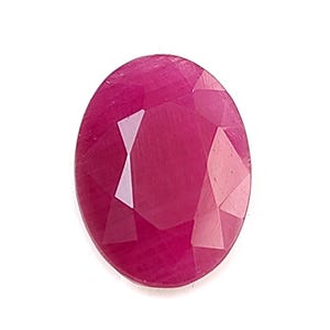 May include: An oval-shaped, faceted gemstone with a deep, vibrant magenta-red color. The stone features a polished surface with multiple triangular and trapezoidal facets that reflect light, creating distinct highlights across its translucent body.