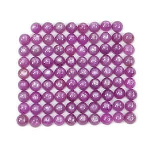 May include: A collection of numerous small, round, polished beads in a vibrant magenta-pink color. The beads are arranged in a dense, grid-like pattern, showcasing a smooth, reflective surface and consistent spherical shape across the entire set.