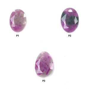 May include: Three faceted gemstones labeled P1, P2, and P3. P1 is an oval pink and white stone. P2 is an oval pink and dark green stone. P3 is a pear-shaped pink and white stone. Each gemstone features a polished, multi-faceted surface.