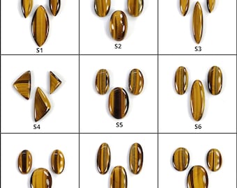May include: Nine sets of polished tiger's eye gemstones, each with a unique shape and arrangement. The stones display a warm, golden-brown color with dark brown stripes. The gemstones are oval, teardrop, and triangular shapes.