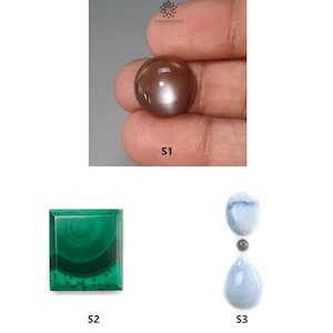 May include: Three gemstone cabochons: a brown sunstone, a green malachite, and a blue opal. The sunstone is round, the malachite is square, and the opal is a teardrop shape.