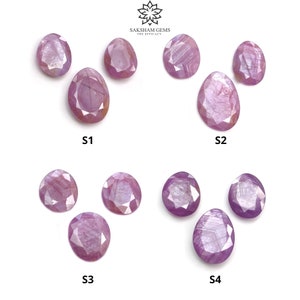 Puede incluir: Una colección de zafiros rosas facetados de forma ovalada. Las piedras preciosas varían en tamaño y forma, con estructuras internas y reflejos de luz visibles. La imagen incluye el texto "SAKSHAM GEMS THE EFFICACY" y las etiquetas S1, S2, S3 y S4.